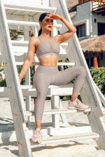 Load image into Gallery viewer, Woman in athletic wear sitting on beach in MILF workout set
